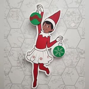 The Elf on the Shelf Scout Elf Brown Eye Girl Cut Out Wall Decor,13x18 Faux Wood
